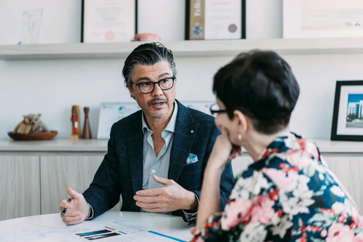 Sydney Bariatric Clinic doctor consulting with a patient at his desk