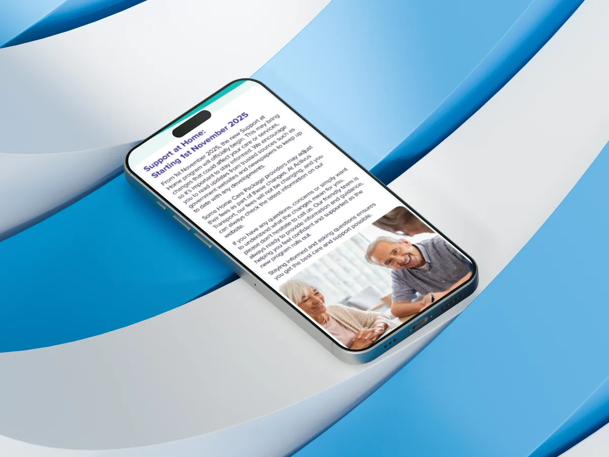 Phone screen displaying a Support at Home program update article with an elderly couple photo