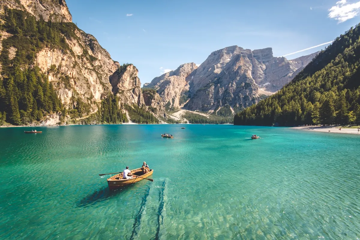 Aerial view of a mountain lake with rowboats