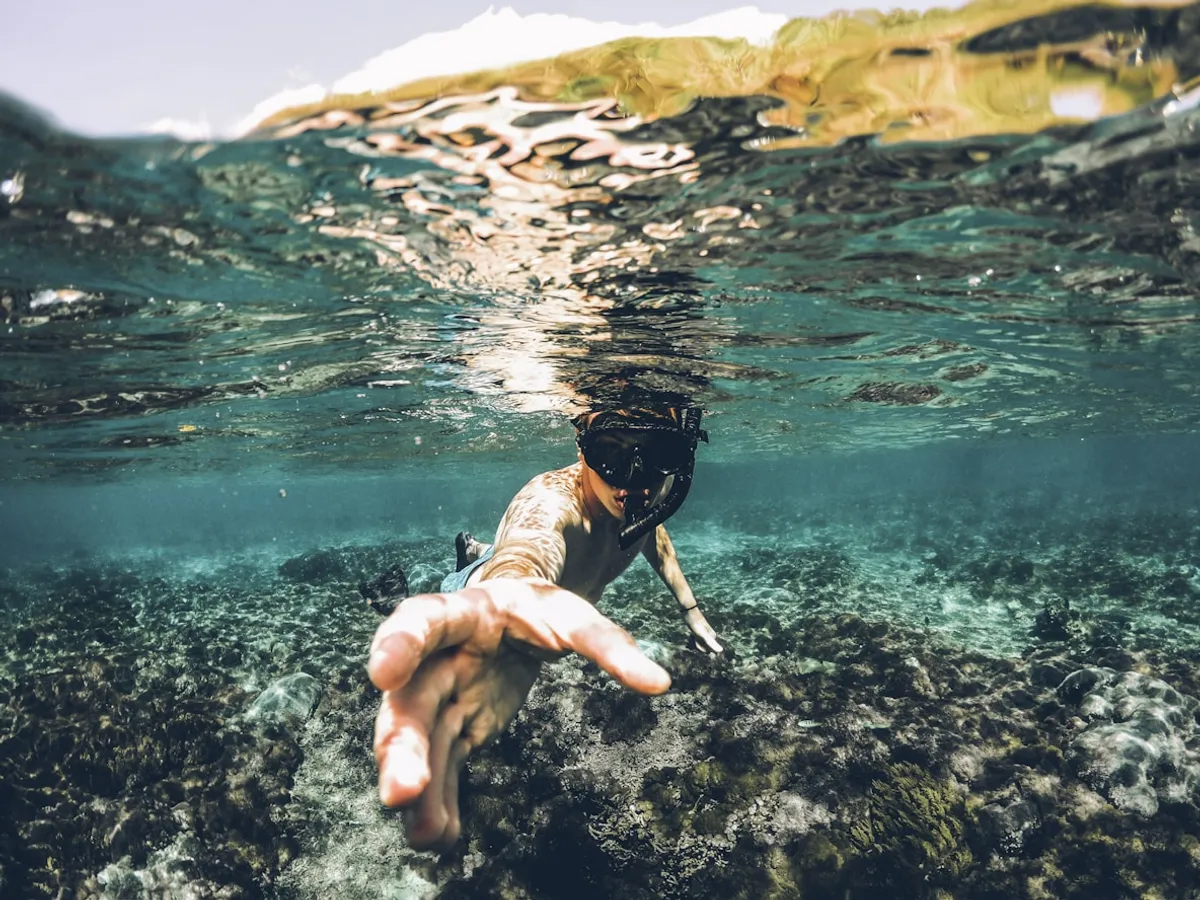 Traveler snorkeling underwater